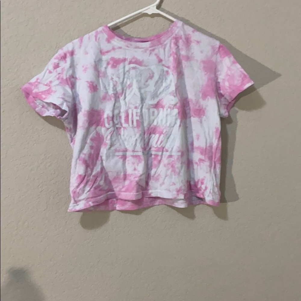 pink and white cropped shirt